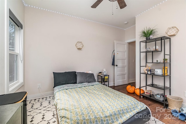 bedroom featuring wood-type flooring and ceiling fan