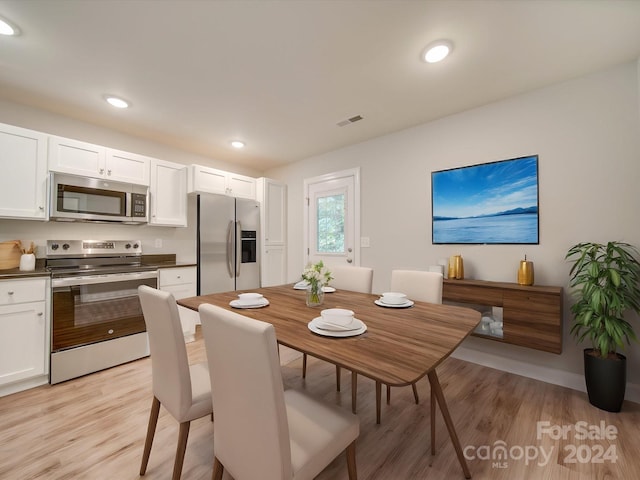 dining space featuring light hardwood / wood-style flooring