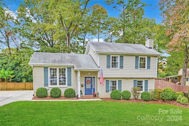 split level home with a front yard