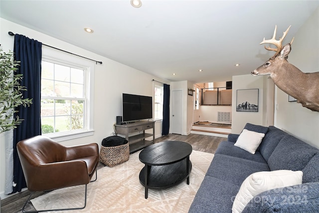 living room with light hardwood / wood-style flooring