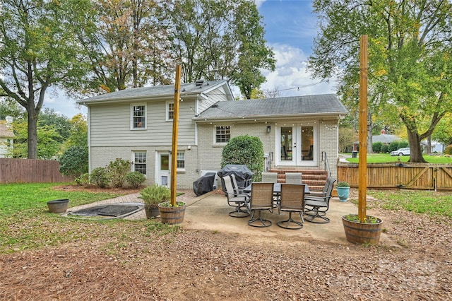 rear view of house with a patio