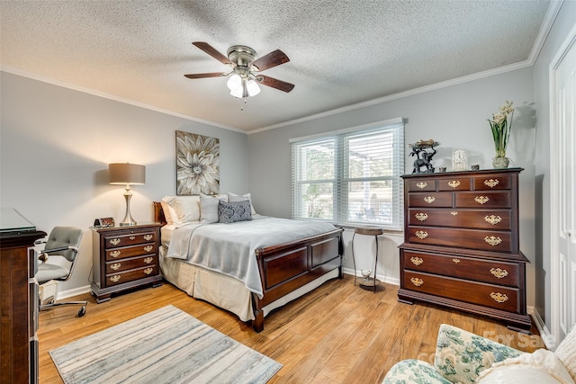 bedroom featuring ornamental molding, light hardwood / wood-style flooring, a textured ceiling, and ceiling fan