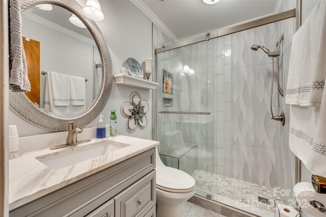 bathroom with a shower with door, toilet, ornamental molding, vanity, and tile patterned floors