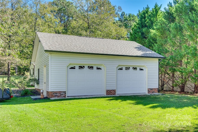 garage featuring a yard