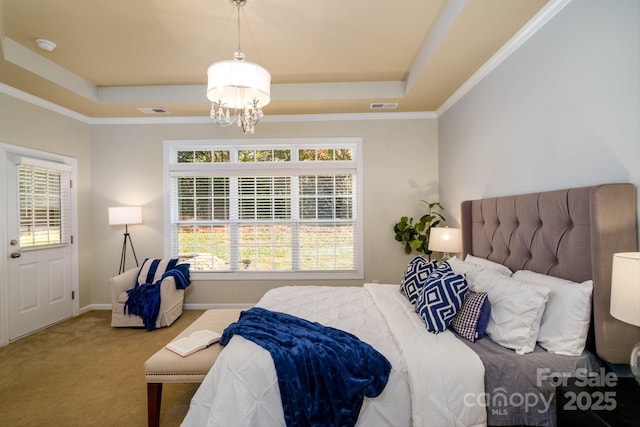 bedroom with a chandelier, carpet floors, a raised ceiling, and ornamental molding