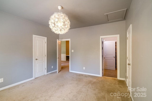 unfurnished bedroom featuring light carpet and a chandelier