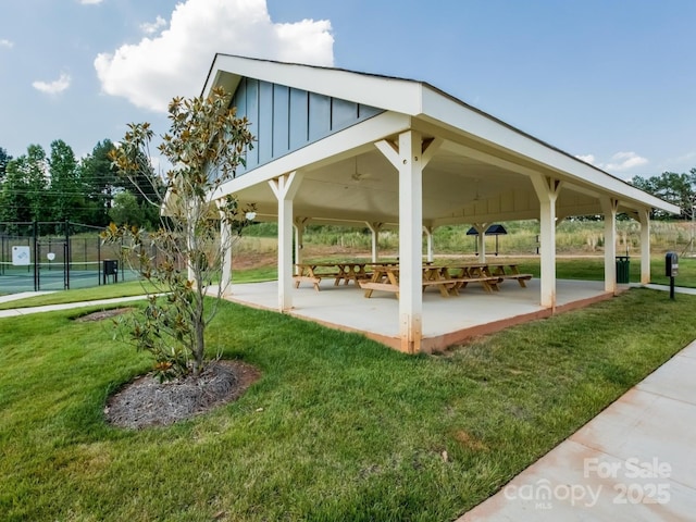 surrounding community with a gazebo, a patio area, and a lawn