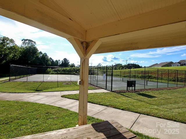 exterior space featuring basketball hoop and tennis court