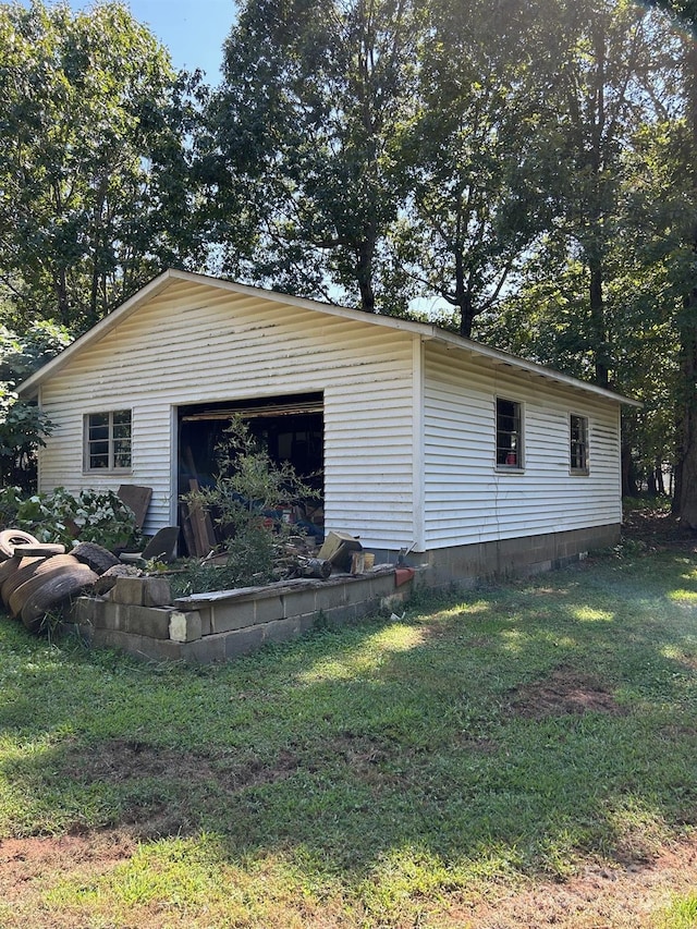 view of property exterior featuring a yard