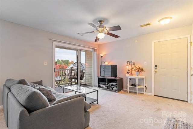 living room with light carpet and ceiling fan