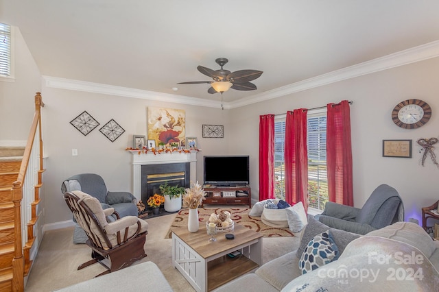 living room featuring crown molding, light colored carpet, and ceiling fan