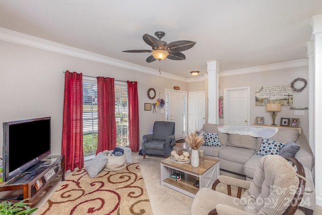 carpeted living room with decorative columns, ceiling fan, and ornamental molding