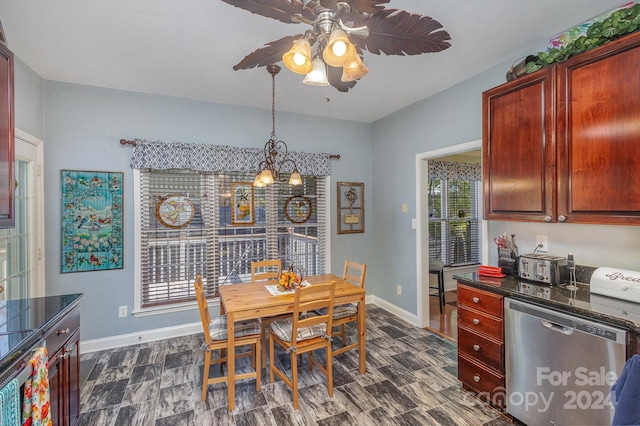 dining area featuring a wealth of natural light and ceiling fan with notable chandelier