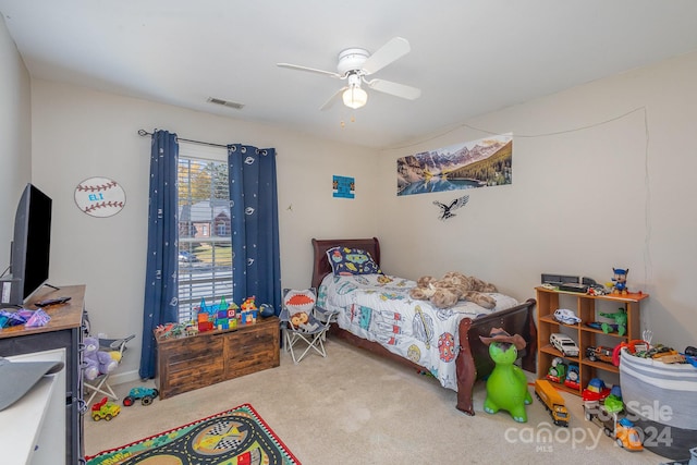 carpeted bedroom with ceiling fan