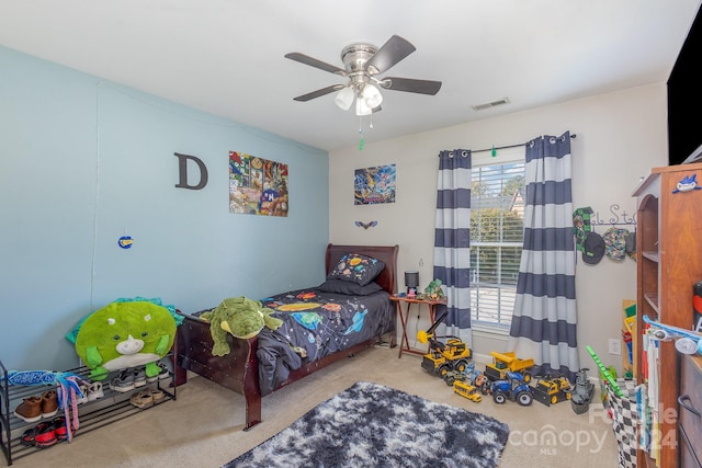 carpeted bedroom with ceiling fan