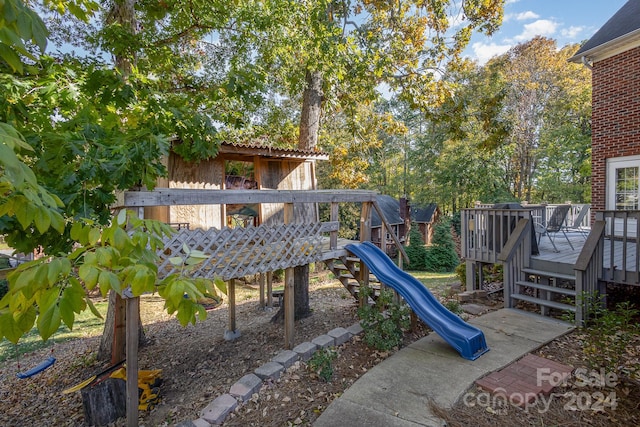 view of jungle gym featuring a wooden deck