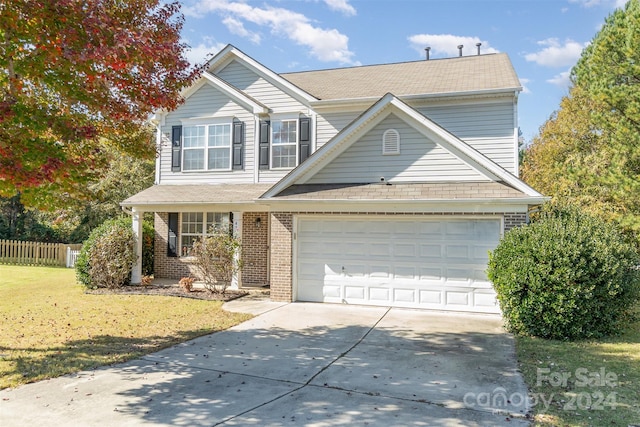 front of property with a front lawn and a garage