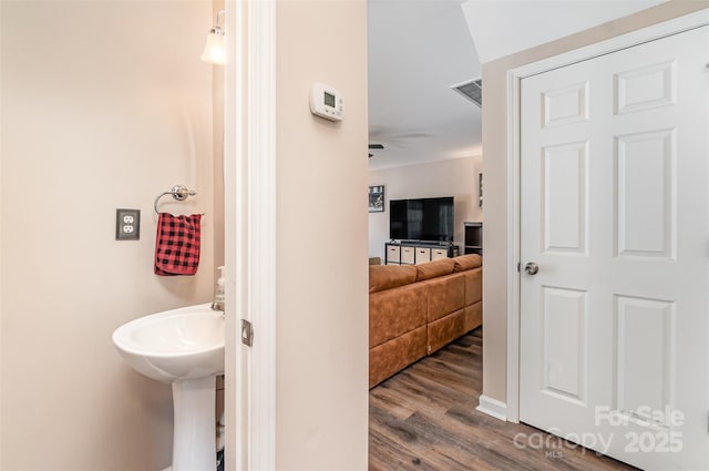 bathroom featuring hardwood / wood-style flooring