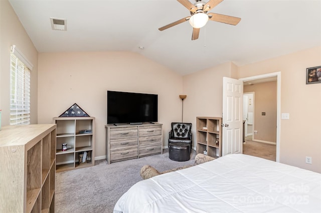 carpeted bedroom with lofted ceiling and ceiling fan