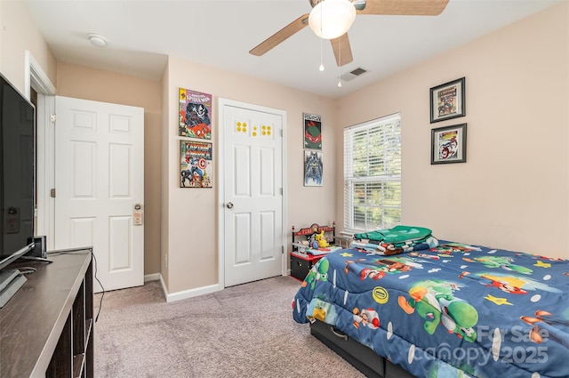 bedroom featuring light colored carpet and ceiling fan