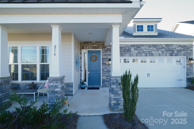 property entrance featuring covered porch and a garage