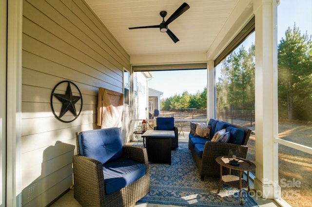 sunroom / solarium with ceiling fan and wooden ceiling