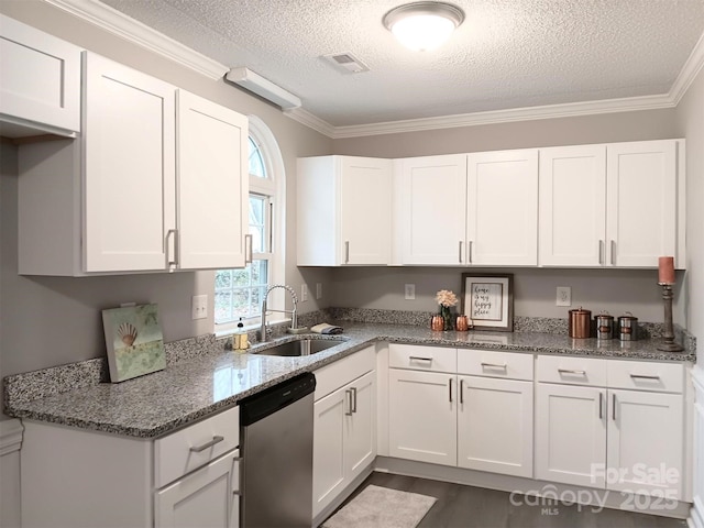 kitchen with dishwasher, white cabinets, a textured ceiling, and sink