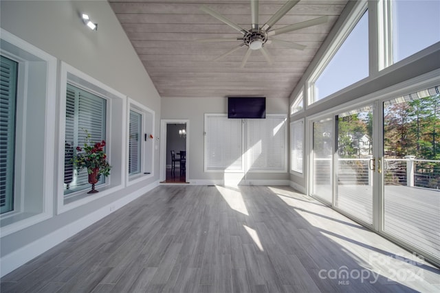 unfurnished sunroom with ceiling fan, wooden ceiling, and vaulted ceiling