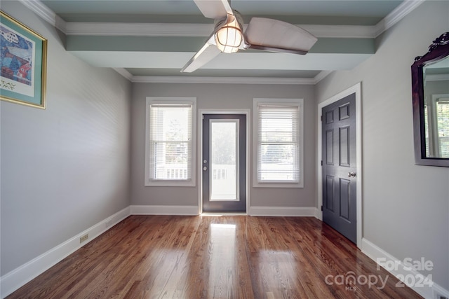 foyer entrance with ceiling fan, wood-type flooring, and ornamental molding