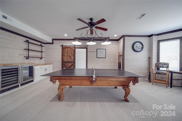 playroom with light carpet, wooden walls, and ceiling fan