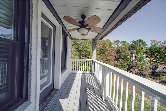 wooden deck featuring ceiling fan