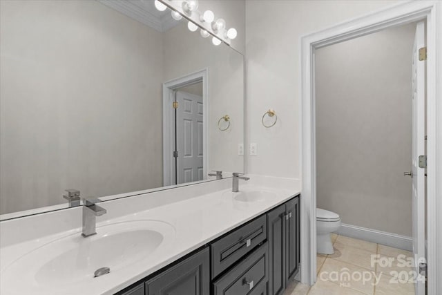 bathroom featuring toilet, vanity, and tile patterned floors