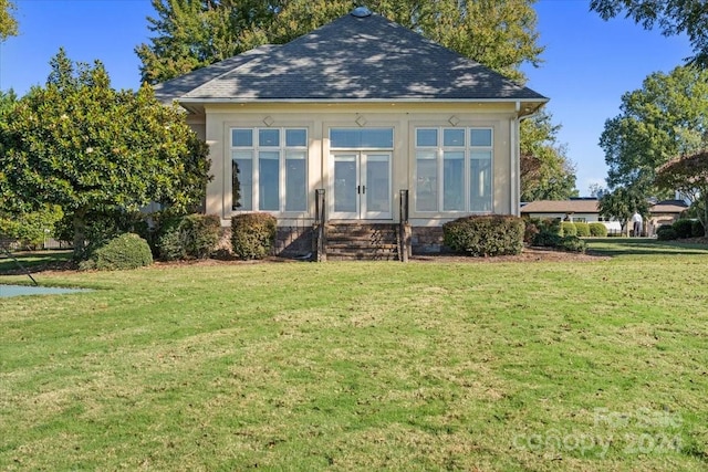 view of outbuilding with a yard