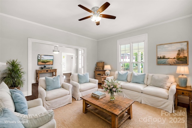 living area featuring ceiling fan, crown molding, and wood finished floors