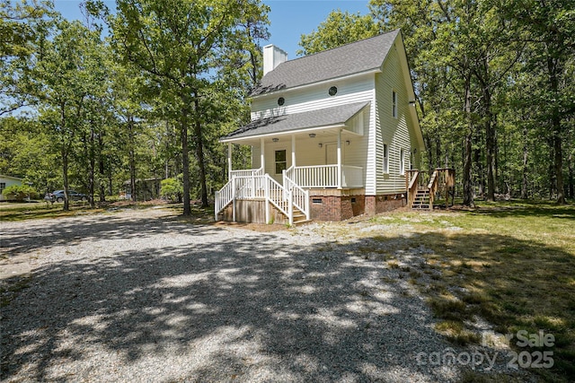 1062 Full Count Ln, Lancaster, SC 29720 - view of front of house featuring covered porch, stairs, roof with shingles, a chimney, and crawl space