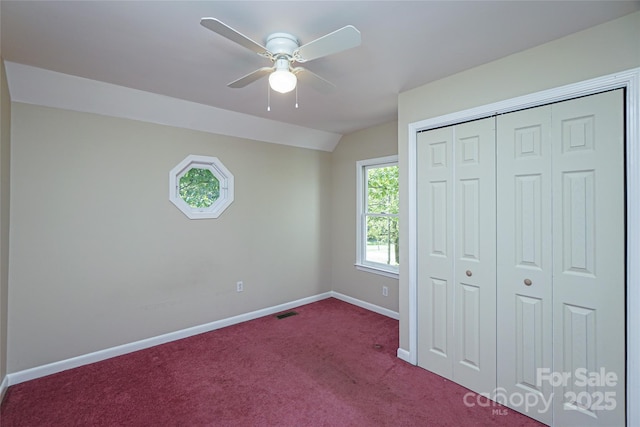 1062 Full Count Ln, Lancaster, SC 29720 - unfurnished bedroom with dark colored carpet, baseboards, a closet, a ceiling fan, and lofted ceiling