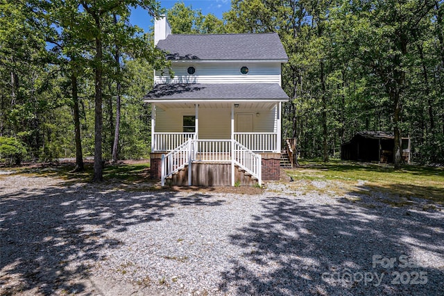 1062 Full Count Ln, Lancaster, SC 29720 - view of front of home featuring stairs, a porch, a shingled roof, a chimney, and an outdoor structure