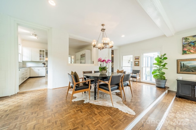 dining space with crown molding, recessed lighting, beamed ceiling, and an inviting chandelier