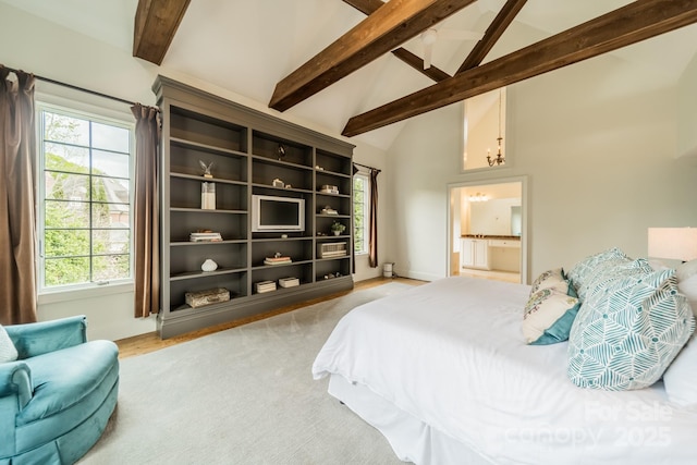 bedroom featuring high vaulted ceiling, ensuite bath, beam ceiling, and baseboards