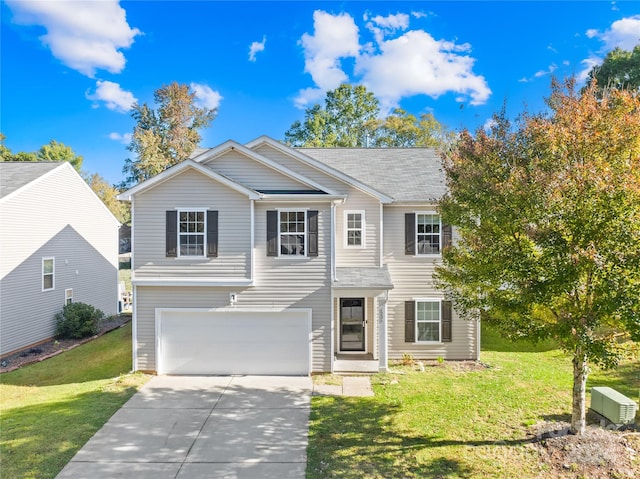 view of front of property with a front lawn and a garage