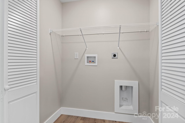 clothes washing area featuring hardwood / wood-style floors, washer hookup, and electric dryer hookup