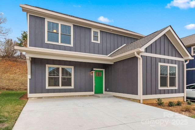 92 Wheeler Rd, Weaverville, NC 28787 - view of front of house featuring a shingled roof, board and batten siding, and a patio area
