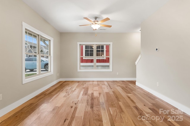 92 Wheeler Rd, Weaverville, NC 28787 - unfurnished living room featuring light wood-style flooring, ceiling fan, and baseboards
