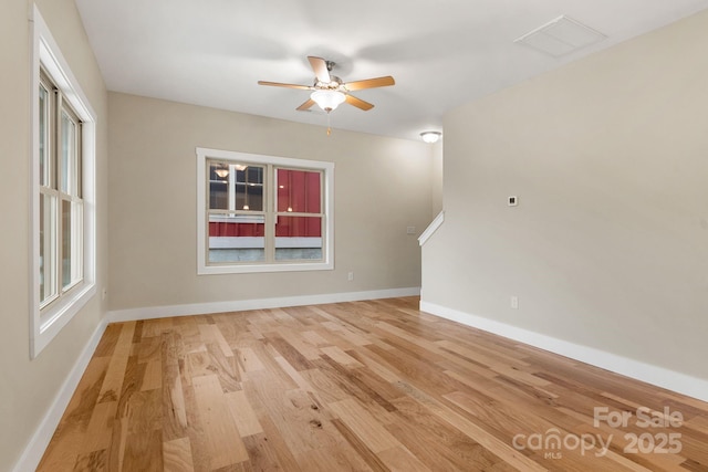 92 Wheeler Rd, Weaverville, NC 28787 - unfurnished living room with ceiling fan, light wood-style flooring, and baseboards