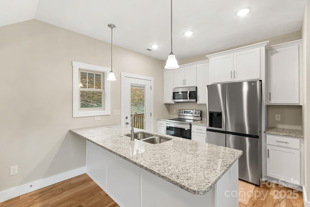 92 Wheeler Rd, Weaverville, NC 28787 - kitchen with appliances with stainless steel finishes, a sink, white cabinets, a peninsula, and light wood-type flooring
