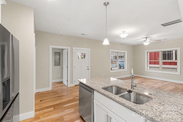92 Wheeler Rd, Weaverville, NC 28787 - kitchen with a sink, appliances with stainless steel finishes, light wood finished floors, white cabinets, and a ceiling fan