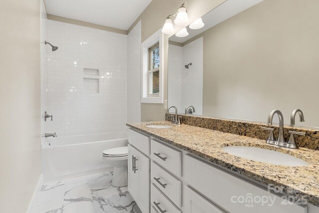 92 Wheeler Rd, Weaverville, NC 28787 - full bath with double vanity, toilet, marble finish flooring,  shower combination, and baseboards