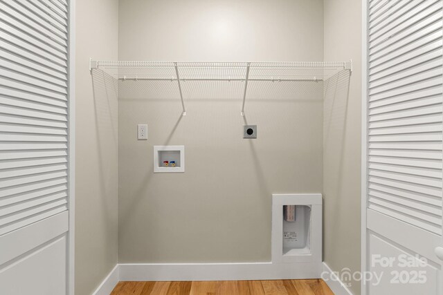 92 Wheeler Rd, Weaverville, NC 28787 - washroom featuring hookup for a washing machine, baseboards, light wood-type flooring, and electric dryer hookup