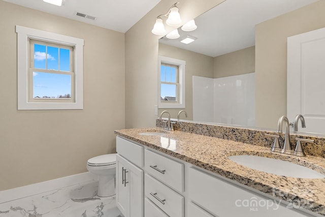 92 Wheeler Rd, Weaverville, NC 28787 - full bathroom with baseboards, double vanity, toilet, marble look tiles, and a shower