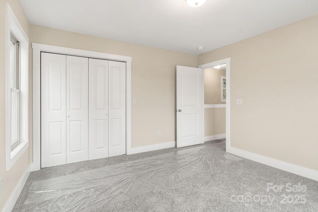 92 Wheeler Rd, Weaverville, NC 28787 - unfurnished bedroom with carpet flooring, baseboards, and a closet